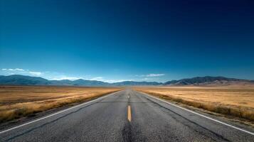 Open road under a vast sky leading toward distant mountains inviting adventure and exploration photo