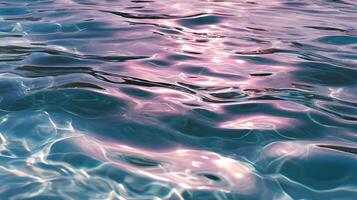 Gentle waves create shimmering patterns on the water's surface, reflecting soft pinks and blues, a serene seascape photo