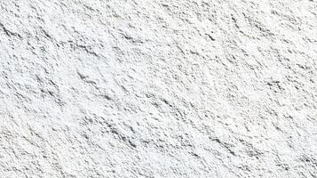 Rough textured white surface with subtle shadows creating a natural stone like visual effect ideal for backgrounds photo