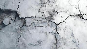 Abstract cracked surface presents a compelling visual texture showcasing damage and aging with grayscale undertones photo