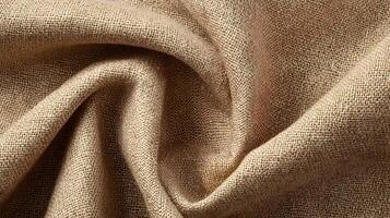 Abstract close up shot of beige fabric with soft curves and subtle shadows creating a serene texture photo