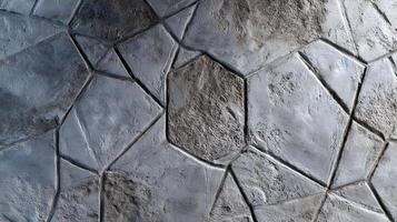 Texture of modern stone wall with geometric pattern provides a gray scale background suitable for many applications photo