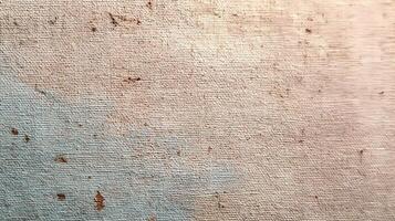 Detailed close up of an aged canvas texture with subtle color variations and organic speckling throughout its surface adding depth photo