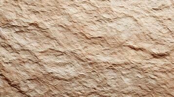 Texture of rough stone surface in warm beige tones creating a natural earthy pattern background photo