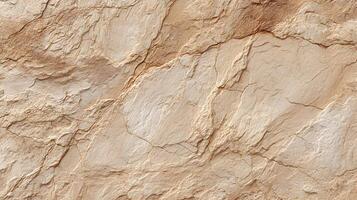 Abstract tan and brown rock texture background with many natural cracks and crevices creating pattern photo