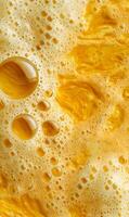 Golden bubbles reflecting light create an abstract textural background perfect for various artistic projects and designs photo