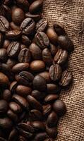 Roasted coffee beans against a textured burlap background inviting warmth and the promise of a delightful brew photo