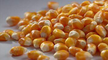 Detailed close up of vibrant orange popcorn kernels, showcasing textures and the promise of a delicious snack photo