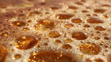Golden drops adorn a textured surface creating a mesmerizing play of light and shadow beauty abstract photo