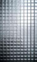 Subtle interplay of light and shadow on textured glass surface creating a serene and elegant aesthetic photo