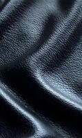 Close up of dark luxurious leather texture with intricate surface pattern creating an elegant backdrop ideal for fashion and design projects photo