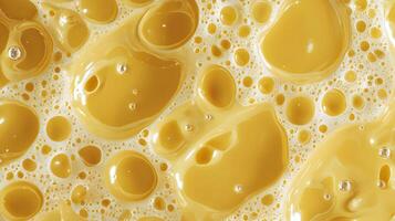 Abstract closeup of golden liquid with bubbles capturing a mesmerizing blend of texture and light photo