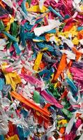 Vibrant explosion of shredded paper creating a mesmerizing abstract artwork filled with color and texture photo
