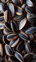 Close up capture showcasing the intricate patterns and textures of black and white sunflower seeds creating visual depth photo
