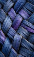 Intricate weaving of vibrant blue and purple fibers creating a captivating textured abstract pattern close up photo