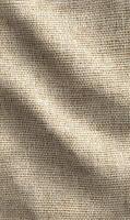 Warm tones of a natural burlap fabric with its rough texture create a rustic and comforting atmosphere photo