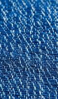 Detailed macro shot of blue denim fabric showcases its intricate weave and texture patterns capturing raw beauty photo