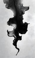 Abstract black ink cloud against a soft white background creating a dreamy ethereal atmosphere and feeling photo