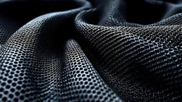 Intricate waves of dark netted fabric creating a textured and modern abstract background element photo