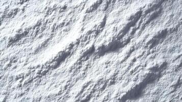 Abstract white surface exhibiting rough texture with shadows creating a dynamic and serene visual experience photo