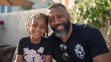 A man and a young girl smiling for the camera photo