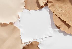A pile of torn paper with a piece of paper on top photo