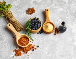Natural spices with herbs and powder on gray surface photo