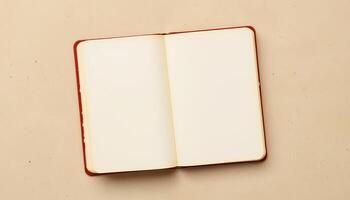 Open blank notebook on beige surface with soft lighting creating calm and inviting atmosphere photo
