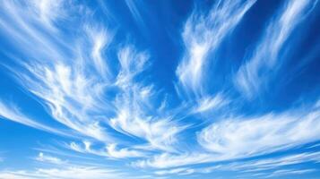 Vibrant Blue Sky with Wispy Cirrus Clouds A Summertime Dreamscape of Air and Sunlight Above photo