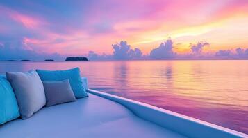 Serene Sunset Vista Pillows on a Couch Overlooking Calm Waters with a Colorful Sky and Distant Islands photo