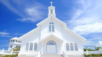 Stark White Chapel Under a Bright Blue Sky An Idyllic Religious Setting photo