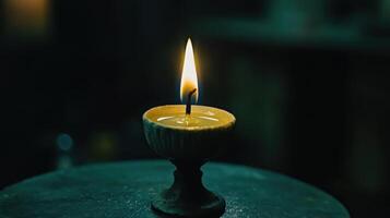 Serene Flicker A Single Candles Gentle Glow in the Darkness Still Life photo