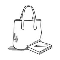 A tote bag resting beside a sketchpad and markers vector
