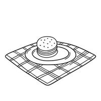 A cookie rolling off a tray placed on a tablecloth vector