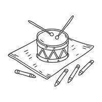 A toy drum near scattered crayons on the mat vector