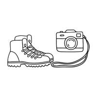A camera next to a pair of hiking boots, strap trailing on the ground vector