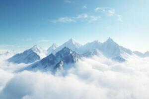 a mountain range is seen above the clouds photo