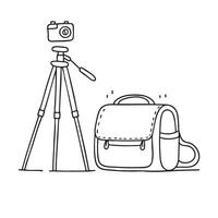 A tripod near an open camera bag vector
