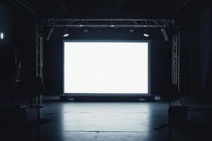an empty stage with a large screen photo