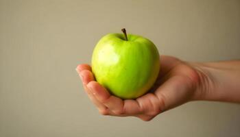 hand holding green apple photo