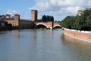 Picturesque view of Castelvecchio and the Scaliger Bridge over the Adige River in Verona. photo