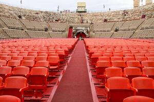Red seats in the historic amphitheater arena. photo