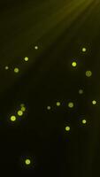 Animated particle with light rays on dark background video