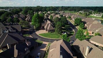 A drone view of a residential area in America. Cottage low-rise buildings. Summer day photo