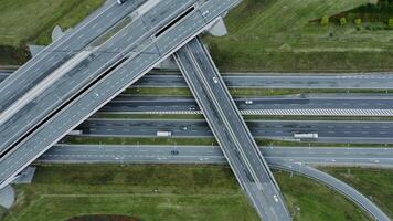 Multilevel road, top view, filming from a quadrocopter. View of the road junction with cars passing along it, shooting from a drone - shooting photo