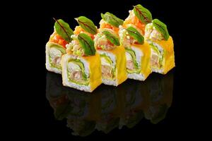 Five colorful uramaki sushi rolls are reflecting on a black background photo