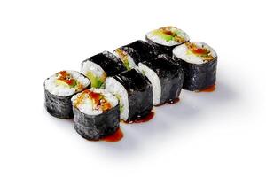 Delicious sushi rolls with eel, avocado, and unagi sauce drizzled on white background photo
