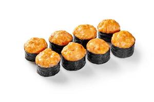 Baked sushi rolls with spicy sauce topping arranged on white background photo