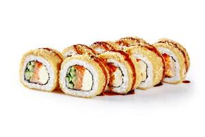 Tempura maki sushi rolls with salmon, cucumber and cream cheese on white background photo