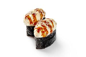 Gunkan maki sushi topped with cream cheese, sesame seeds and unagi sauce on white background photo